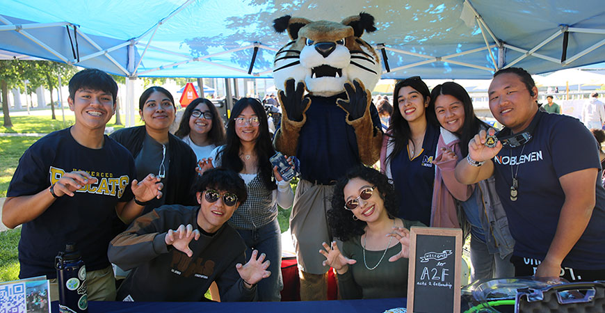 At Bobcat Day 2026, a group of current students and mascot Rufus